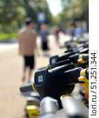 A group of electric scooters are lined up on the sidewalk. Russia. Moscow. 05.09.25. Редакционное фото, фотограф Ярославский Максим / Фотобанк Лори