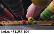 Colorful Counting Beads Engaging in Educational Play. Стоковое видео, видеограф Sergakoff / Фотобанк Лори