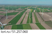 Wind turbines and agriculture fields. Стоковое видео, видеограф Михаил Коханчиков / Фотобанк Лори