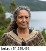 Portrait of an elderly woman in a national traditional costume. Стоковое AI-изображение, AI-художник Андрей Аркуша / Фотобанк Лори