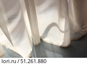 Sheer white curtains with sunlight and shadows on floor. Стоковое фото, фотограф Лариса Потехина / Фотобанк Лори