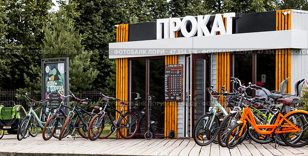 A bicycle or scooter rental point or point. Rent, hire, business. Russia, Moscow region, June 23, 2024. Редакционное фото, фотограф Photojuli / Фотобанк Лори