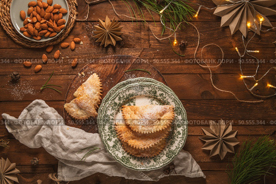 A crescent-shaped pastry whose filling is made of eggs and almonds wrapped in crispy dough, cut in an artisanal way and sprinkled with sugar. Стоковое фото, агентство Ingram Publishing / Фотобанк Лори