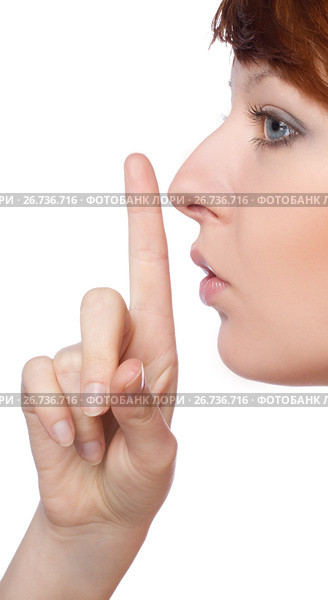a girl holds a finger to lips gesture silently. Стоковое фото, фотограф Tatjana Romanova / Фотобанк Лори