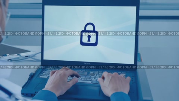 A health professional types securely on a laptop to protect patient information at a clinic. Стоковое AI-видео, аниматор Данила Большаков / Фотобанк Лори