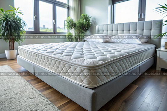 A healthy back. Choosing a mattress. A new white luxurious comfortable orthopedic mattress on the bed in the bright bedroom. Стоковое AI-изображение, AI-художник Photojuli / Фотобанк Лори