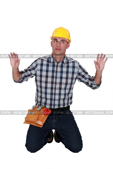 A male construction  worker trapped in an invisible box. Стоковое фото, агентство Ingram Publishing / Фотобанк Лори