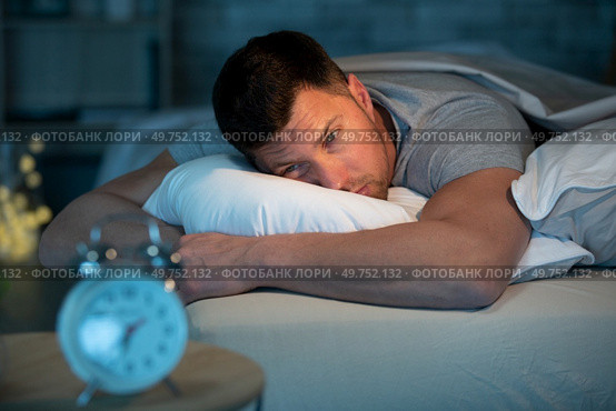a man having trouble sleeping. Стоковое фото, агентство Ingram Publishing / Фотобанк Лори