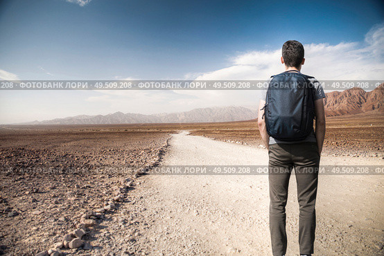 A man walks among the rocks of the Andes in the Nazca desert. Стоковое фото, агентство Ingram Publishing / Фотобанк Лори