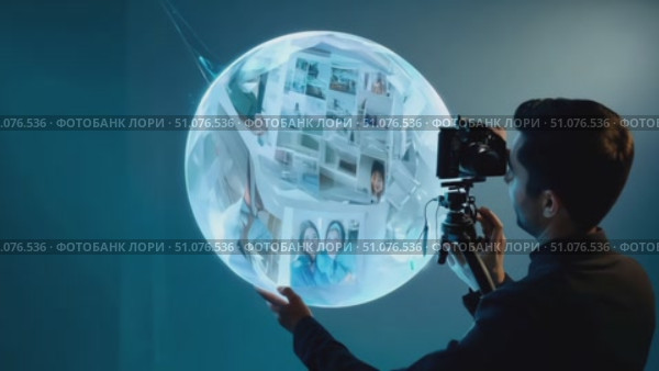 A person captures unique visuals using a spherical device in a creative studio. Стоковое AI-видео, аниматор Данила Большаков / Фотобанк Лори