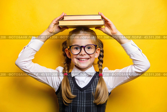 A pretty girl with glasses and books on her head. The child goes to school for the first time. A child on a yellow monochrome background. Back to school. Стоковое AI-изображение, AI-художник Photojuli / Фотобанк Лори