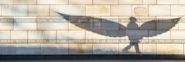 A silhouette of a mans shadow with wings projected on a plain wall, creating an illusion of angelic presence. Стоковое AI-изображение, AI-художник Данила Большаков / Фотобанк Лори