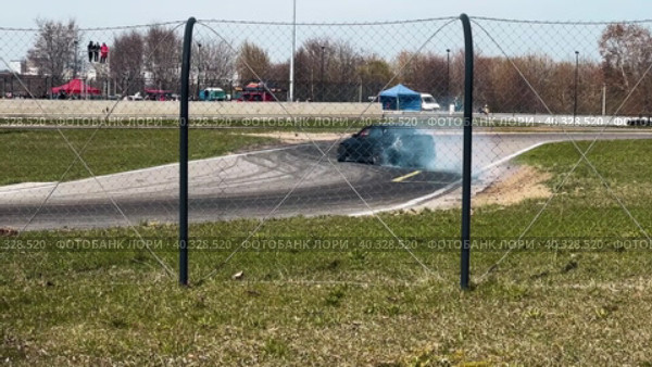 A sports car goes through a turn in a slide. Slow motion. Стоковое видео, видеограф Ярославский Максим / Фотобанк Лори