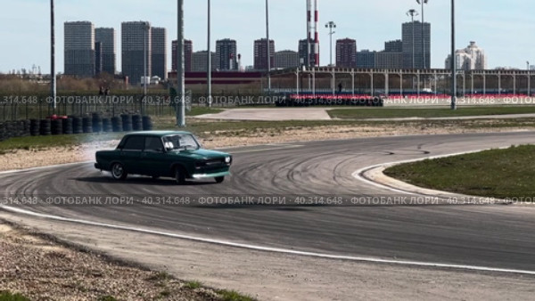 A sports car takes a turn in a skid. Drift racing races. Стоковое видео, видеограф Ярославский Максим / Фотобанк Лори