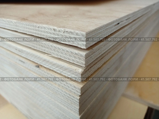 A stack of plywood sheets for construction. Стоковое фото, фотограф Алексей Круковский / Фотобанк Лори