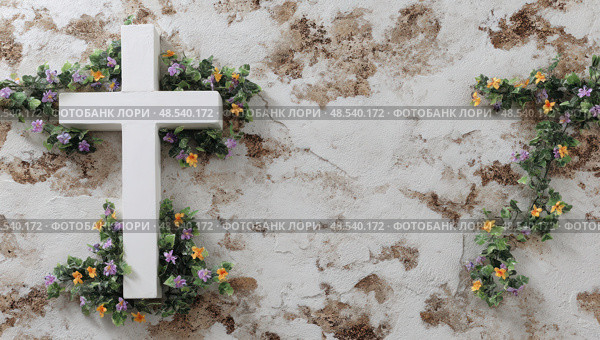 A white cross is surrounded by purple and yellow flowers. Стоковое фото, фотограф Ярославский Максим / Фотобанк Лори