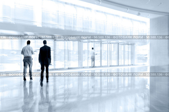 abstract image of people in the lobby of a modern business center with a blurred background. Стоковое фото, агентство Ingram Publishing / Фотобанк Лори