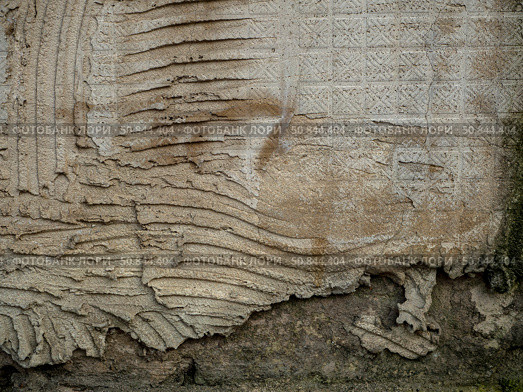 Abstract old unkempt background with uneven plaster. The surface shows striped indentations and a square grid. Стоковое фото, фотограф Бузмакова Светлана / Фотобанк Лори