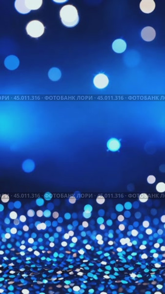 Абстрактный голубой фон с блестками и эффектом боке, вертикальное видео. Стоковое AI-видео, аниматор Анжелика Самсонова / Фотобанк Лори