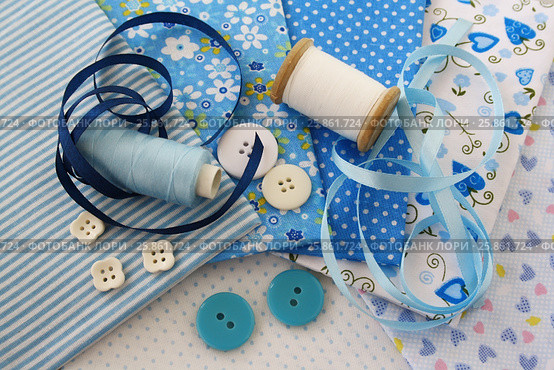 Accessories for sewing: threads, fabric, buttons in blue-white color. Стоковое фото, фотограф Елена Зинина / Фотобанк Лори