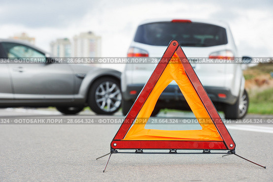 Accident or crash with two automobile. Road warning triangle sign in focus. Стоковое фото, фотограф Дмитрий Калиновский / Фотобанк Лори