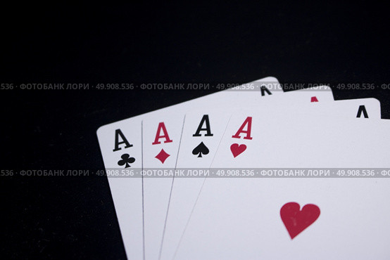 ace four of a kind poker card on dark black background. Стоковое фото, агентство Ingram Publishing / Фотобанк Лори