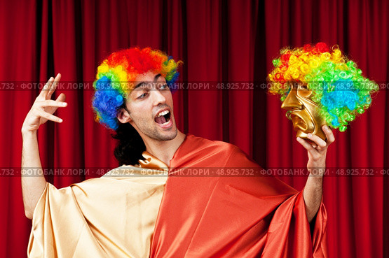 Actor with maks in a funny theater concept. Стоковое фото, агентство Ingram Publishing / Фотобанк Лори