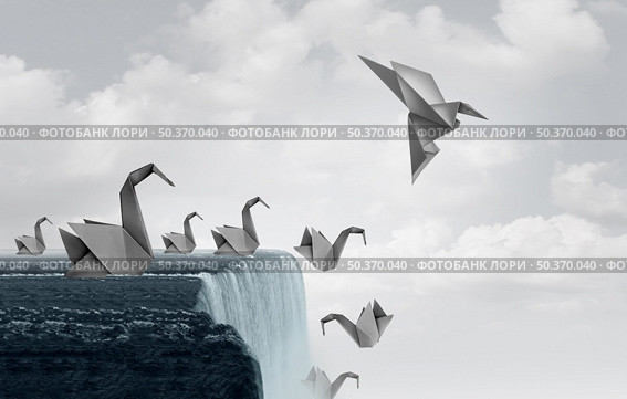 Adapt to survive concept as paper swans falling off a waterfall and one origami bird adapting new skills and flying away to safety. Стоковое фото, агентство Ingram Publishing / Фотобанк Лори
