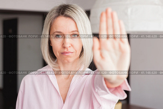 adult woman show stop gesture sign by hand saying no to domestic violence or abuse. Стоковое фото, фотограф Гладских Татьяна / Фотобанк Лори