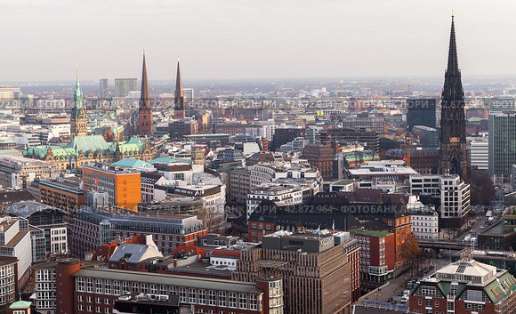 Aerial city view with spire of St. Nicholas Church on the right side (2018 год). Редакционное фото, фотограф EugeneSergeev / Фотобанк Лори