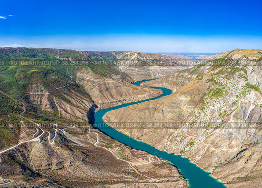 Aerial drone view to deep Sulak canyons. Stunning curving turquoise river among mountains. Picturesque panoramic landscape to valley. The deepest canyon in the world. Sights Dagestan Russia, Europe. Стоковое фото, фотограф Алексей Ширманов / Фотобанк Лори