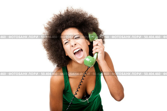 Afro-American young woman answering a call and yelling at phone, isolated on white background. Стоковое фото, агентство Ingram Publishing / Фотобанк Лори
