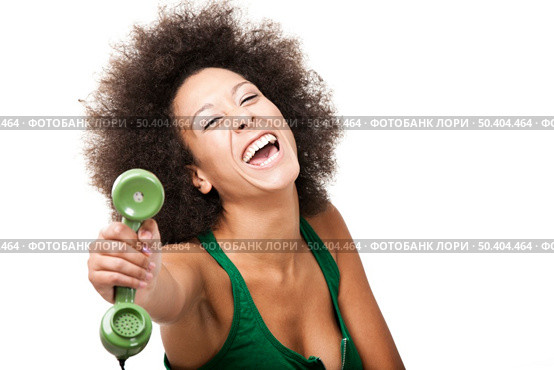 Afro-American young woman answering a call, isolated on white background. Стоковое фото, агентство Ingram Publishing / Фотобанк Лори