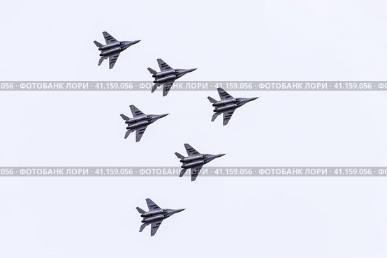 Air show in the sky above the Krasnodar airport flight school. Airshow in honor of Defender of the Fatherland. MiG-29 in the sky. Стоковое фото, фотограф Леонид Еремейчук / Фотобанк Лори