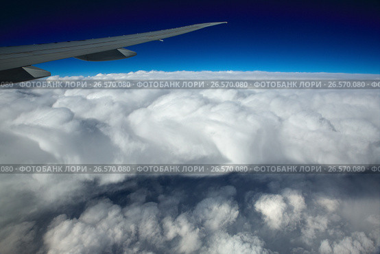 Airplane Wing view from Window during Flight. Стоковое фото, фотограф Roman Barelko / Фотобанк Лори