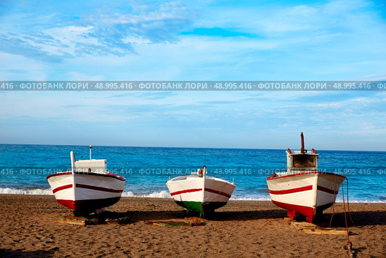 Almeria Cabo de Gata San Miguel beach boats in Spain. Стоковое фото, агентство Ingram Publishing / Фотобанк Лори