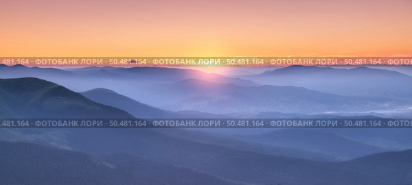 Amazing silhouettes of a mountains at colorful sunset in summer in Ukraine. Landscape with mountain ridges in fog, golden sunlight in the evening. Nature. Hills in sunlight. Scenery	. Стоковое фото, агентство Ingram Publishing / Фотобанк Лори