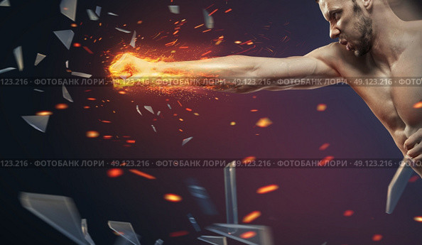 Ambitious businessman crushing an another barrier. Стоковое фото, агентство Ingram Publishing / Фотобанк Лори