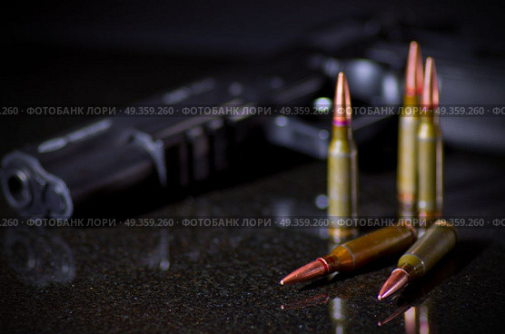 Ammunition cartridges on black background. Ammunition cartridges on black. Стоковое фото, агентство Ingram Publishing / Фотобанк Лори