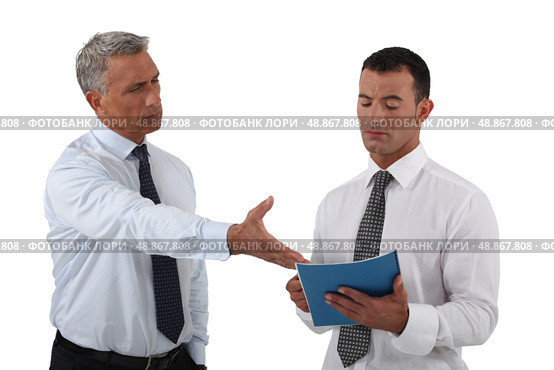 Angry boss displaying his displeasure to his employee. Стоковое фото, агентство Ingram Publishing / Фотобанк Лори