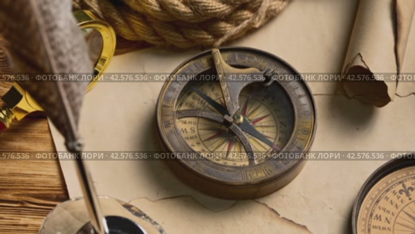 Antique Nautical Compasses on an Old World Map in Soft Lighting. Стоковое видео, видеограф Сергей Толмачёв / Фотобанк Лори