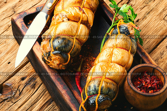 Appetizing fish roll made from smoked mackerel.Hot smoked fish.. Smoked fish roll. Стоковое фото, агентство Ingram Publishing / Фотобанк Лори