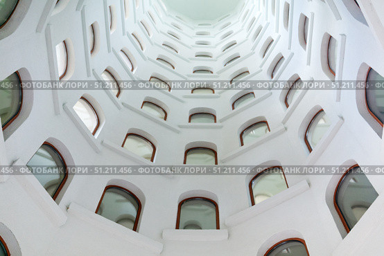 Architectural background, spiral staircase with windows opening into a skylight under the dome. Стоковое фото, фотограф Евгений Харитонов / Фотобанк Лори