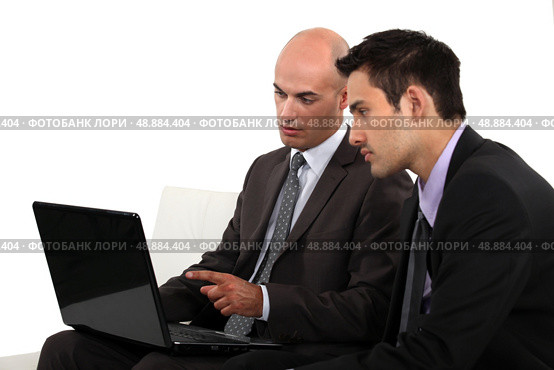 Associates discussing their business plan. Стоковое фото, агентство Ingram Publishing / Фотобанк Лори