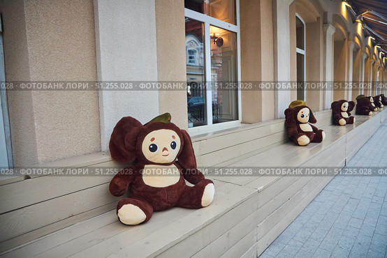 Astrakhan, Russia. - May 07, 2023: Cheburashka, the national Russian cartoon character in the form of a stuffed toy. Редакционное фото, фотограф Наталия Кирсанова / Фотобанк Лори
