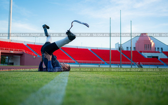 Athletes with disabilities take a break at the stadium between training sessions. Стоковое фото, агентство Ingram Publishing / Фотобанк Лори