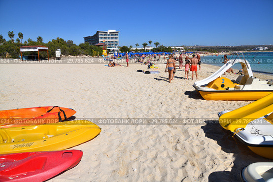 Ayia Napa, Cyprus - November 1. 2018. Pedal catamarans on Makronissos Beach Resort. Редакционное фото, фотограф Володина Ольга / Фотобанк Лори