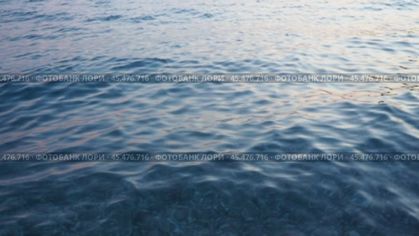 Azure Adriatic Mediterranean Sea. Blue water surface. Travel, boat trips, summer holidays, tourism Montenegro, Bar region. Calm bottomless sea. Travel beach holidays. Aqua ripples. Water background. Стоковое видео, видеограф Юлия Петровская / Фотобанк Лори