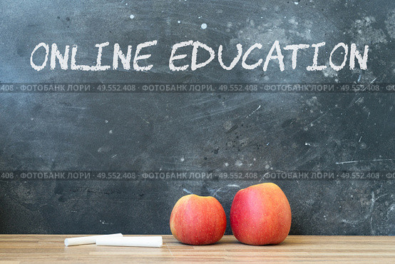 Back to school concept with two red apples and chalk. copy space on blackboard. School and online education background.. back to school. Стоковое фото, агентство Ingram Publishing / Фотобанк Лори