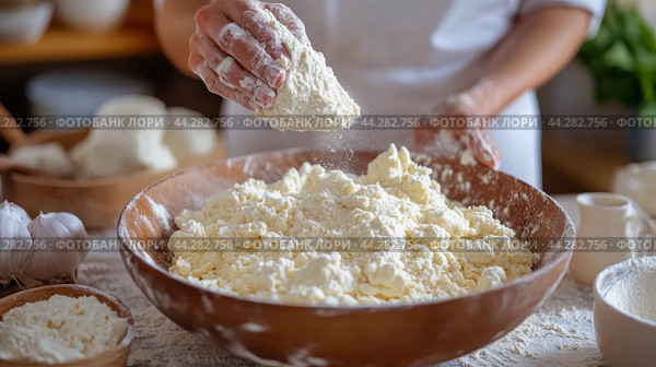 Baker sifts flour in a kitchen with fresh eggs on the counter in the morning light. Стоковое AI-изображение, AI-художник Юлия Гапеенко / Фотобанк Лори